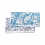 blue and white floral napkin laid flat with repeating botanical border pattern.