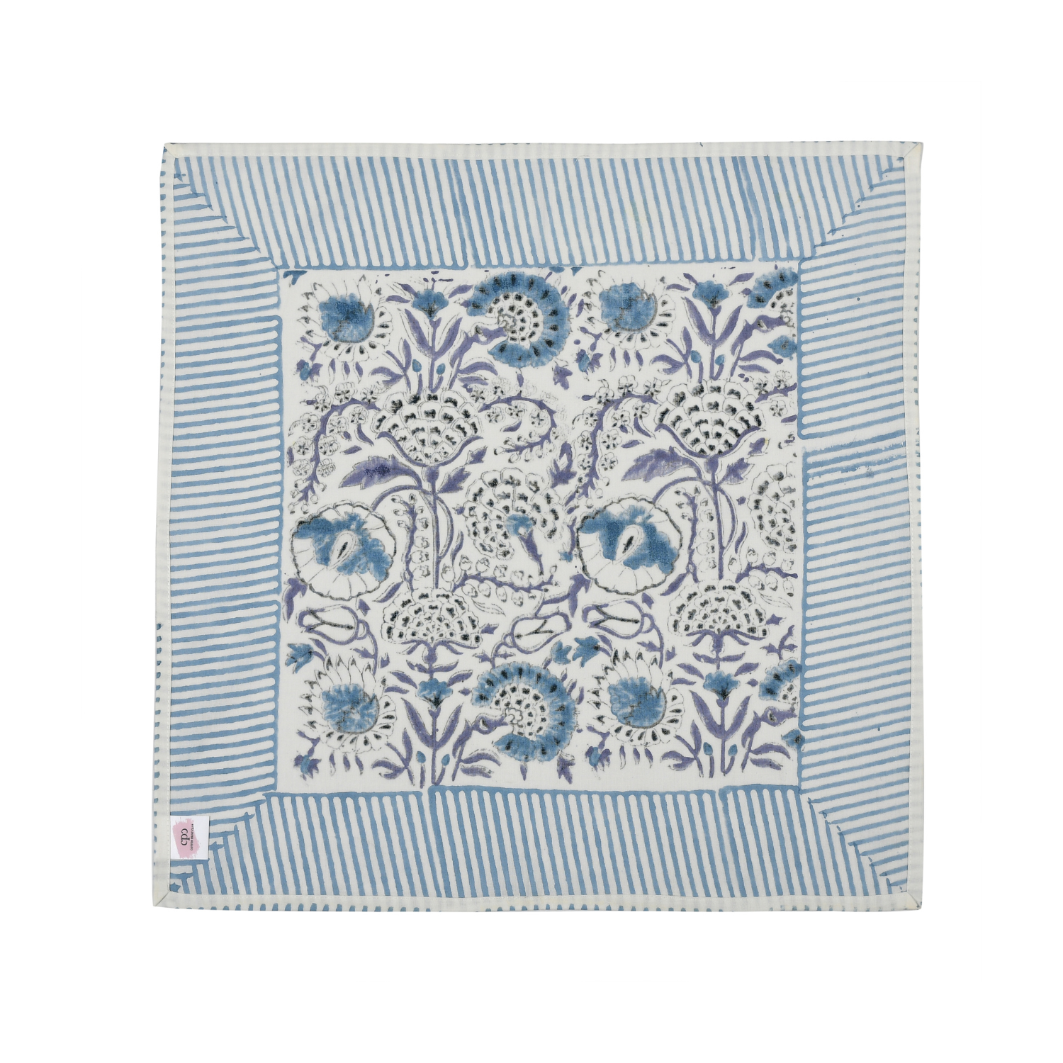 blue botanical block-printed cotton napkin in close-up.

