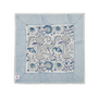 blue botanical block-printed cotton napkin in close-up.

