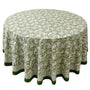 green and white round table cloth on round table with green border lining
