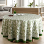 green and white round table cloth on round table with green border lining