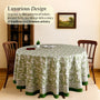 green and white round table cloth on round table with green border lining