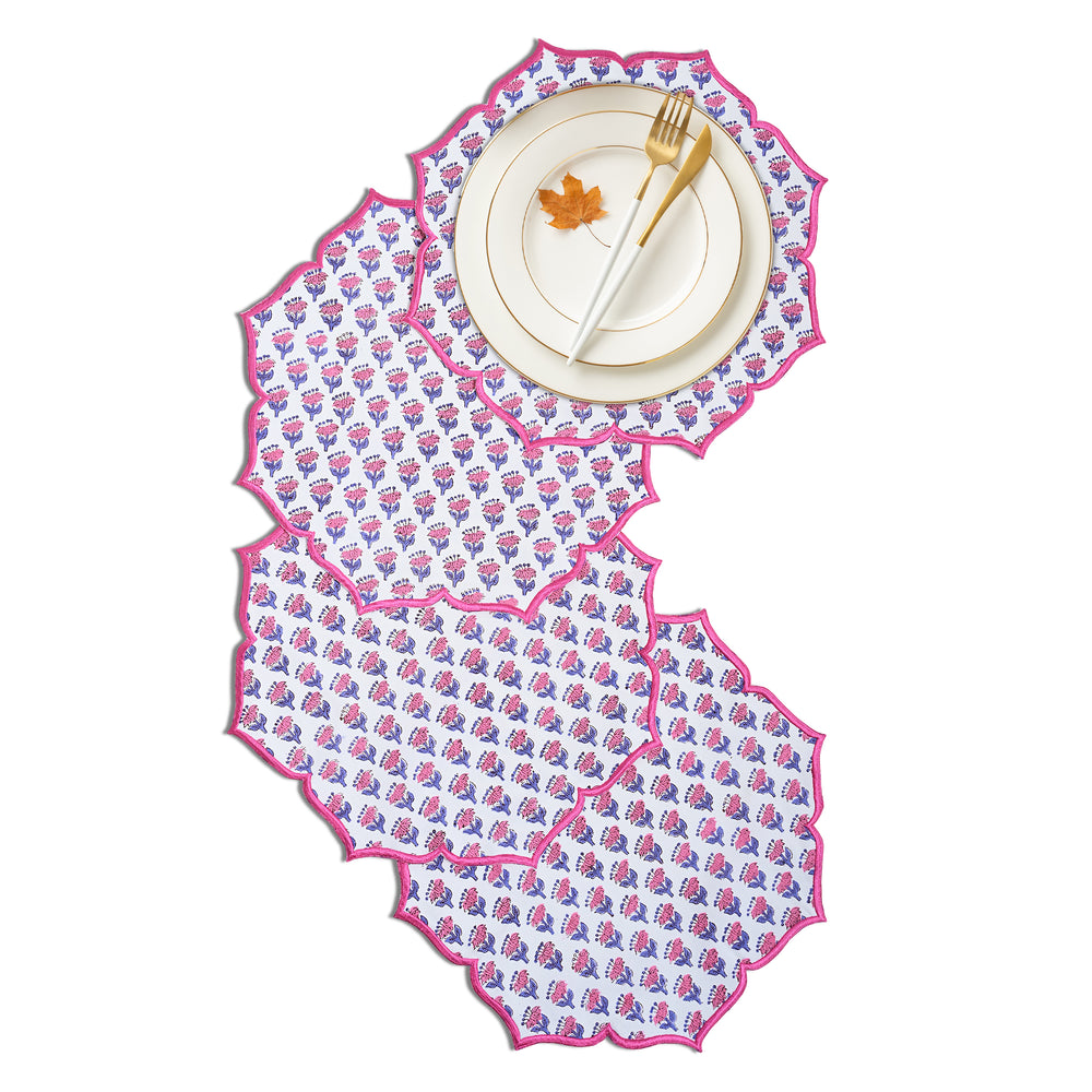Deep pink placemat paired with gold utensils