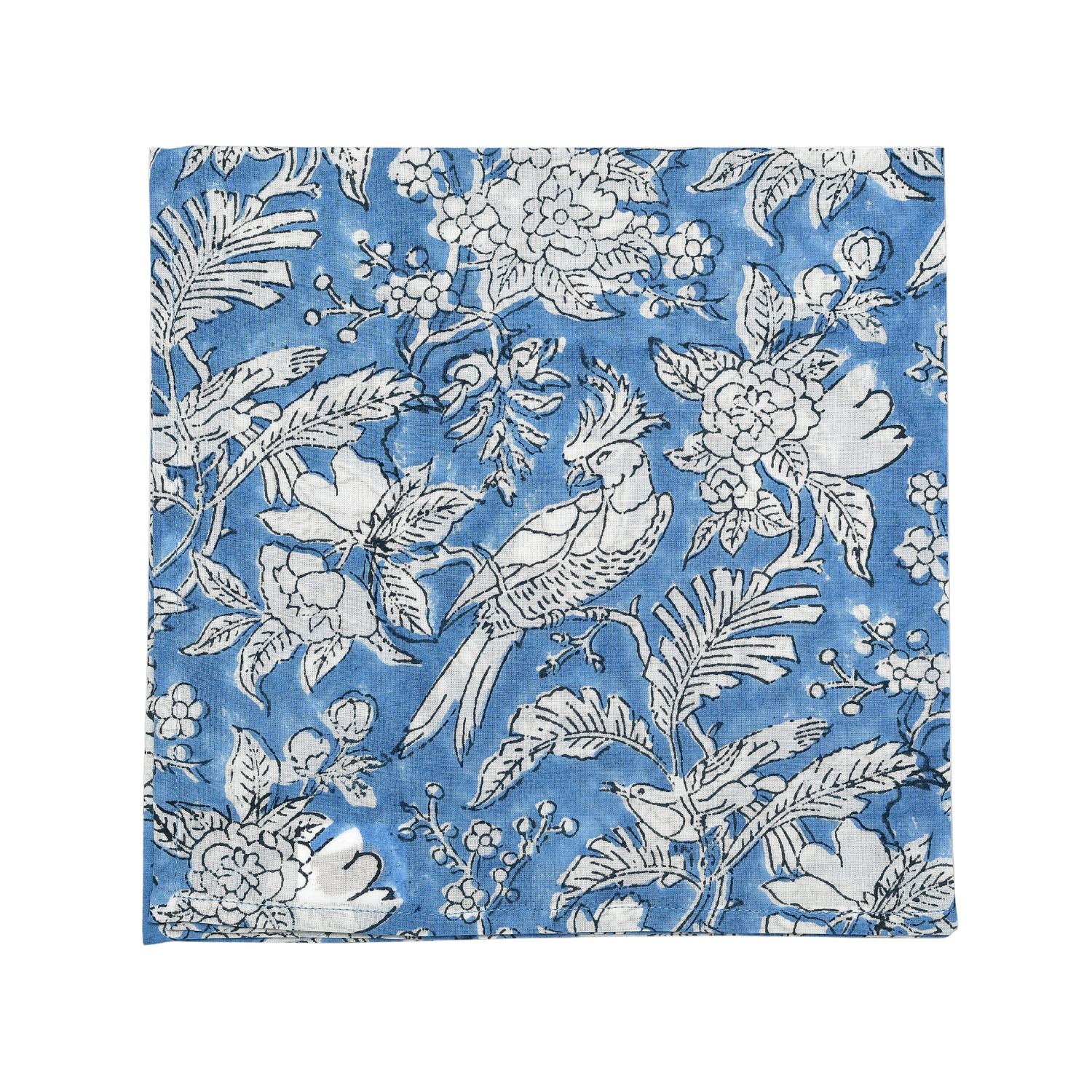 Close-up of detailed blue and white floral print cotton napkin.

