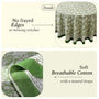 green and white round table cloth on round table with green border lining