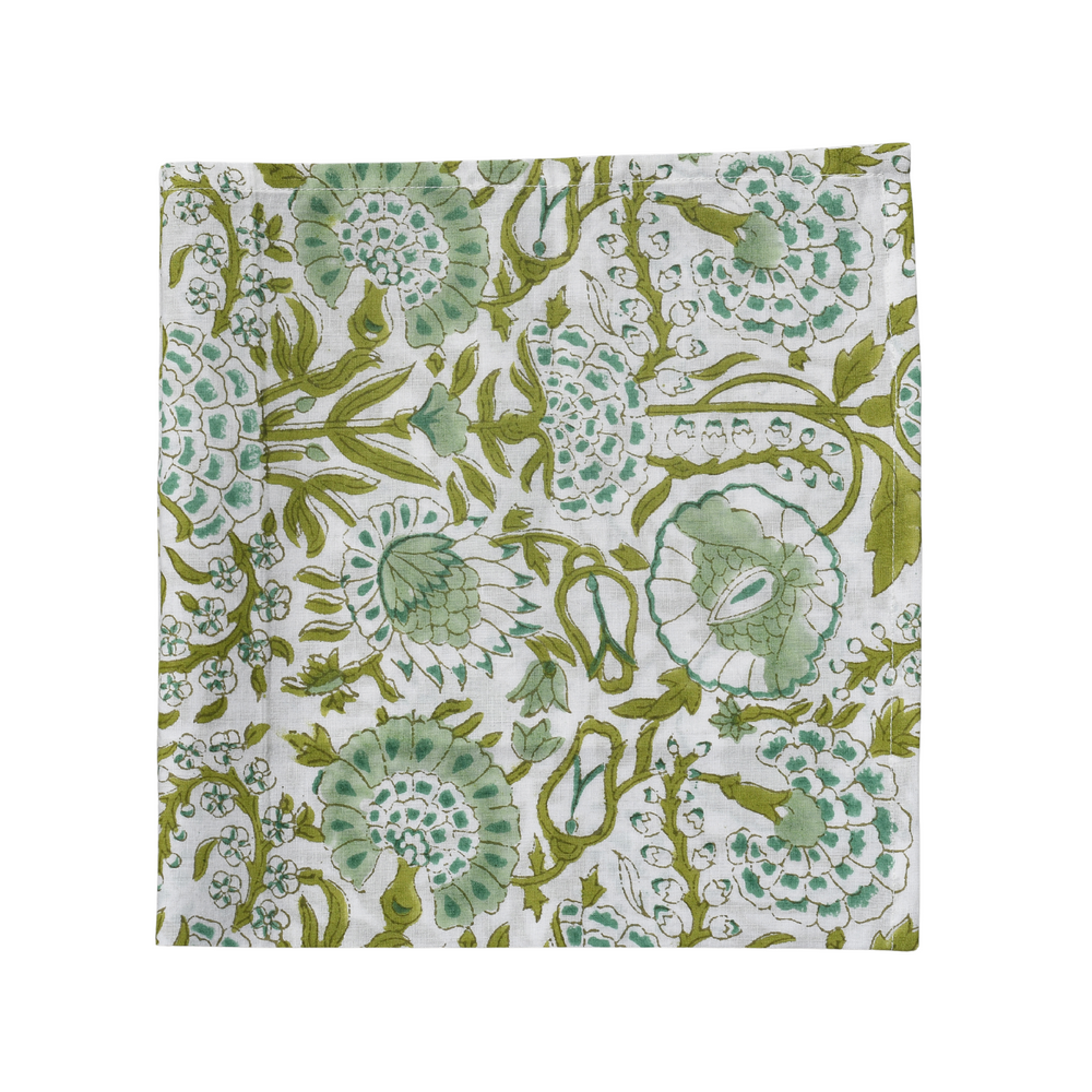 single green and white floral napkin on white background