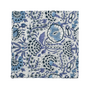 Close-up of detailed blue and white floral print cotton napkin.