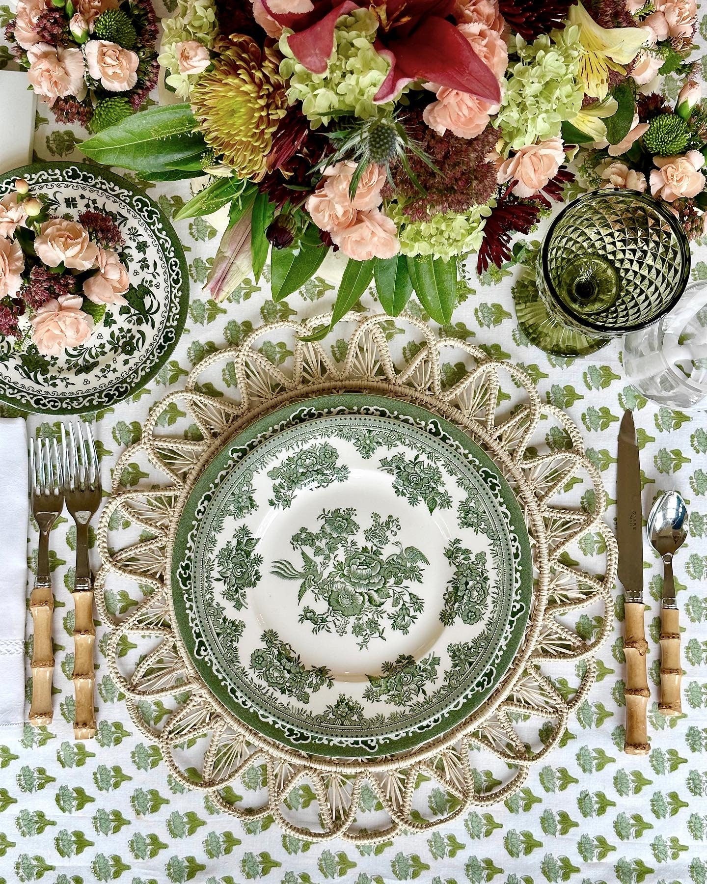 Emerald Green Tablecloth Dining Table Setup with Flowers and Silverware