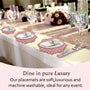 Soft poppy pink placemat on neutral tabletop