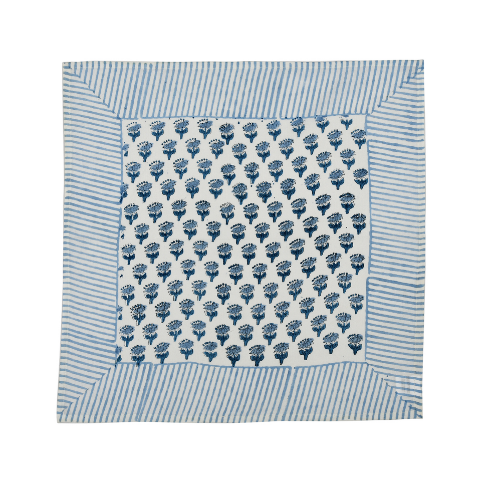 Single flat lay of blue and white floral cotton napkin.

