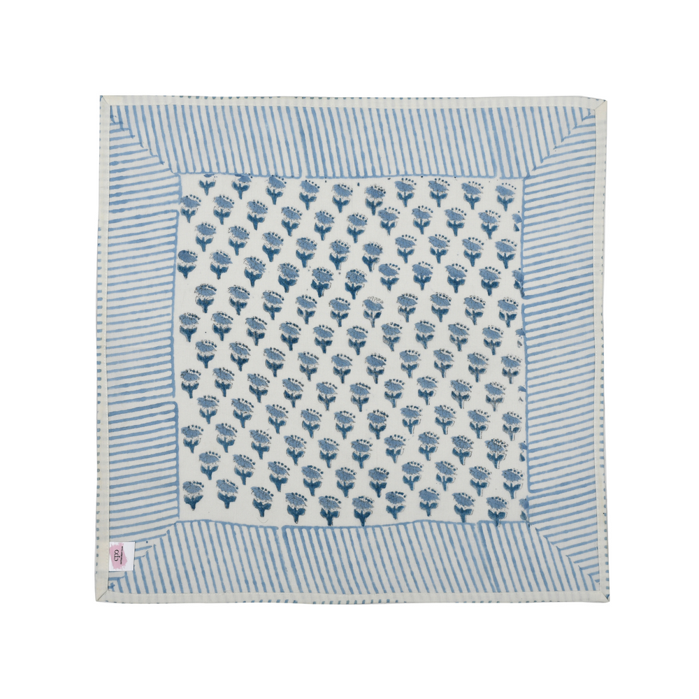 Single flat lay of blue and white floral cotton napkin.

