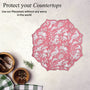Decorative embroidered placemat in coral pink hue