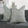 Set of 2 boho pillow covers displayed on neutral couch