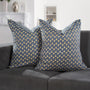 Set of 2 boho pillow covers displayed on neutral couch

