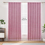 Semi-sheer cotton block print curtains in poppy pink with intricate patterns, hanging in a room with a light filtering through.