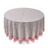 a round table with a white and pink tablecloth