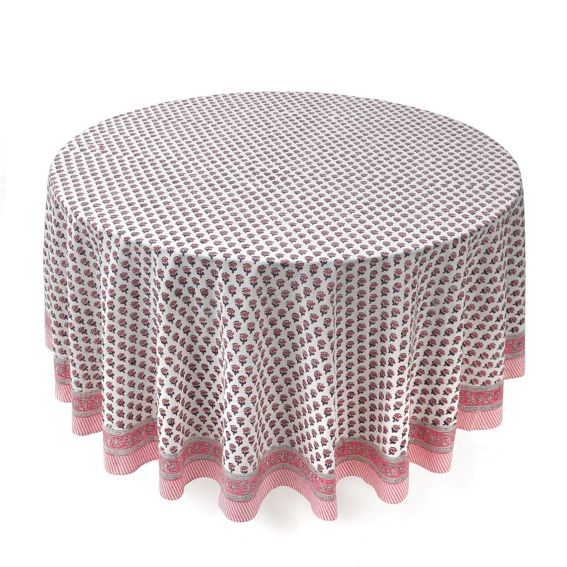 a round table with a white and pink tablecloth