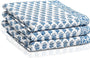 Set of three folded Apatite Blue waffle cotton towels with floral hand block print

