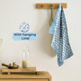 Apatite Blue kitchen towel hanging from hook in a modern kitchen


