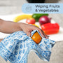 Towel beside fresh produce on a cutting board for lifestyle kitchen scene


