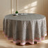 a round table with a flowered tablecloth on it