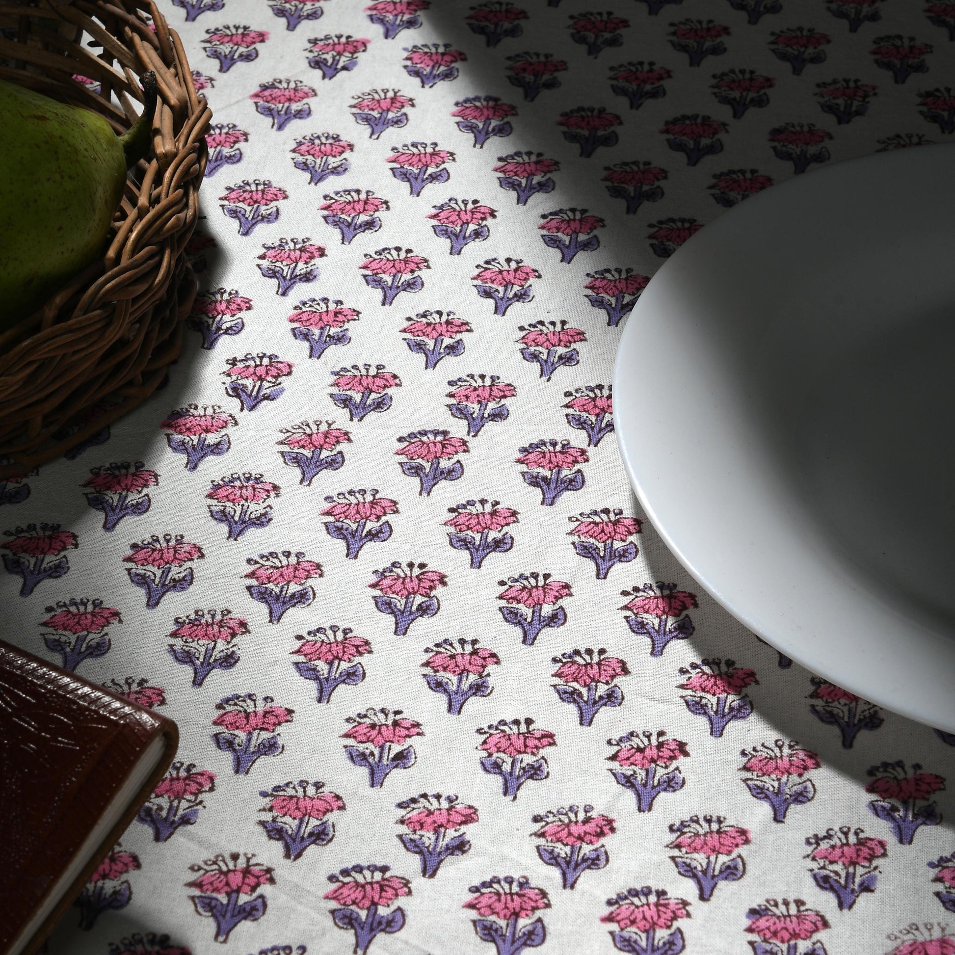 a white plate sitting on top of a table next to a bowl