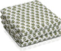 Set of three folded green waffle cotton towels with floral hand block print

