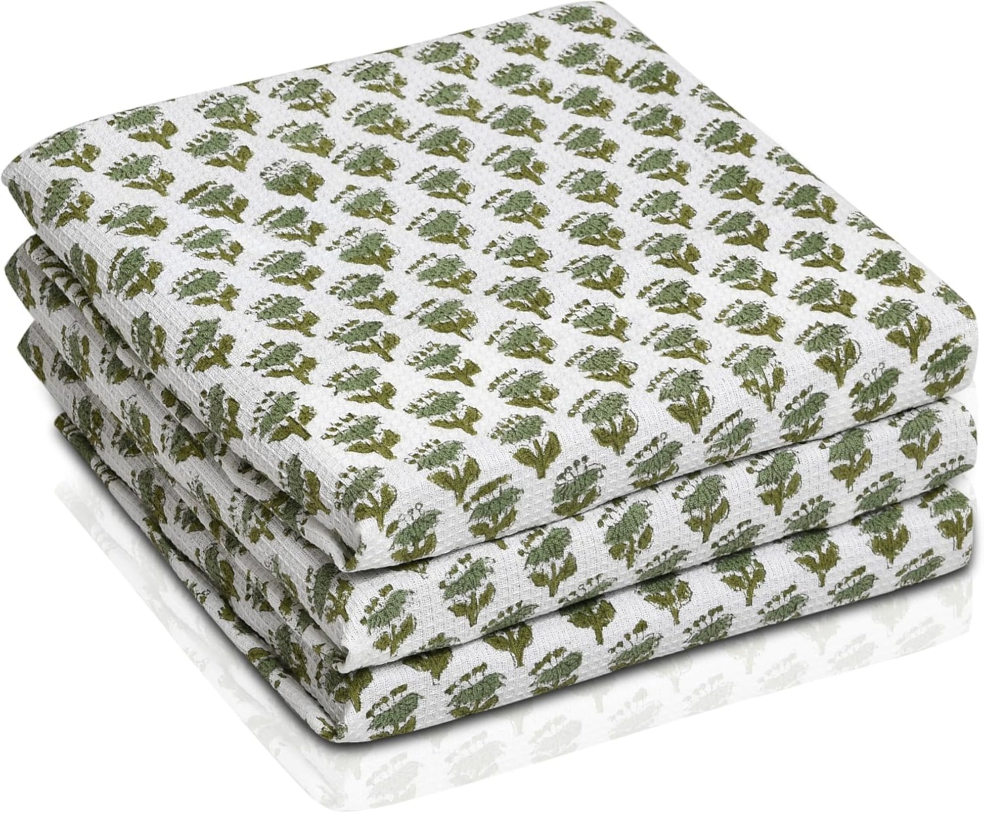 Set of three folded green waffle cotton towels with floral hand block print

