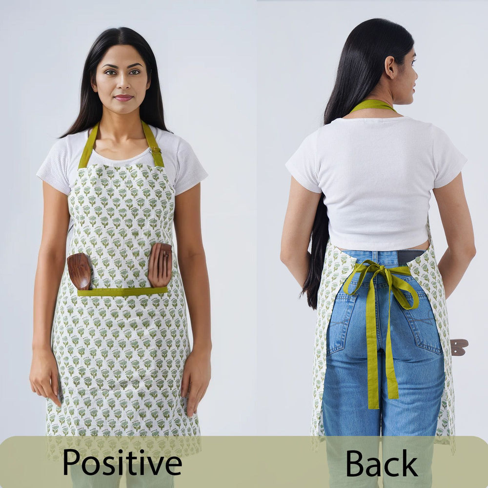 Green and white botanical apron with waist tie and front pockets