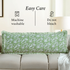 Machine washable green floral block print pillow on beige couch