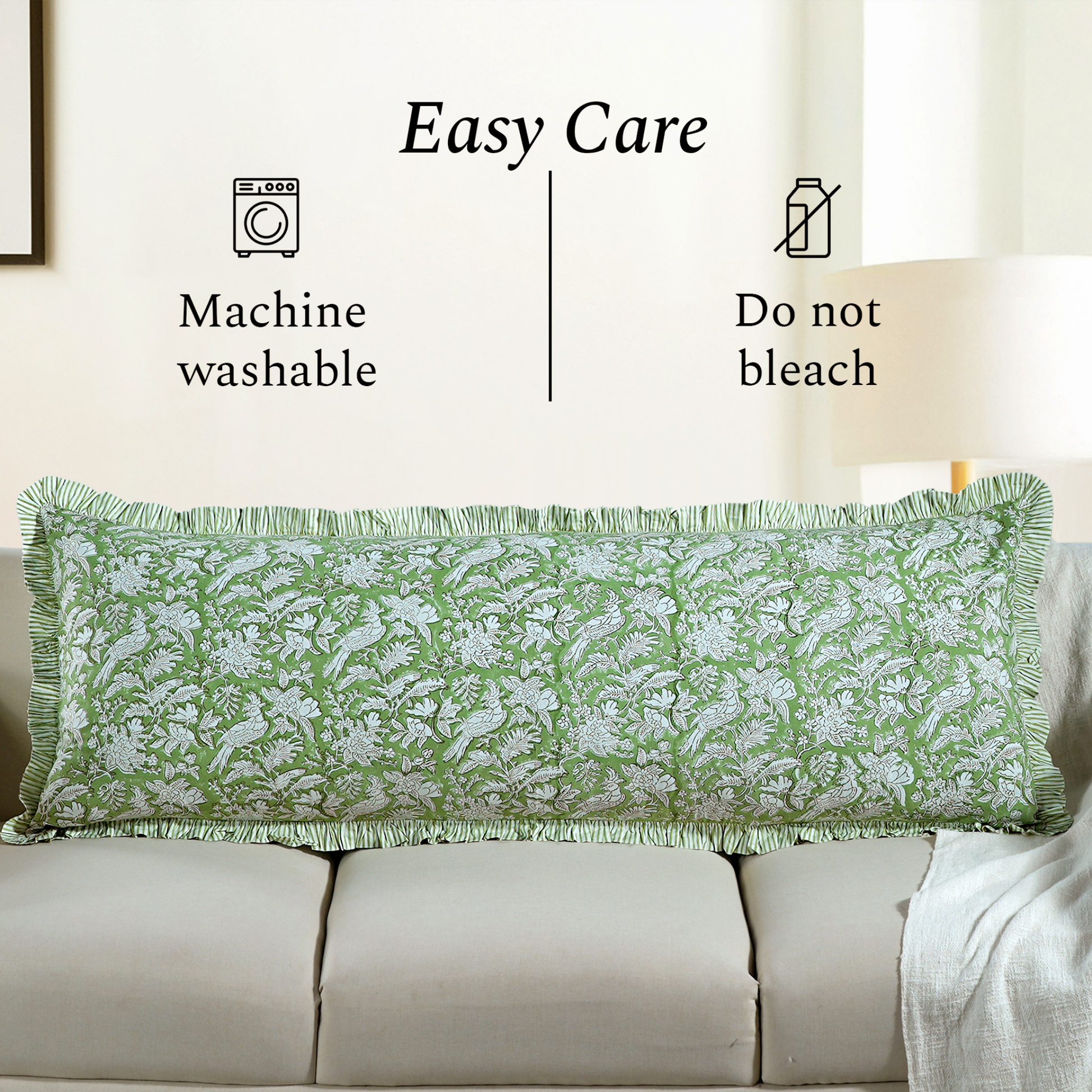 Machine washable green floral block print pillow on beige couch